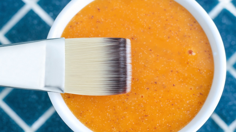 orange mask and brush