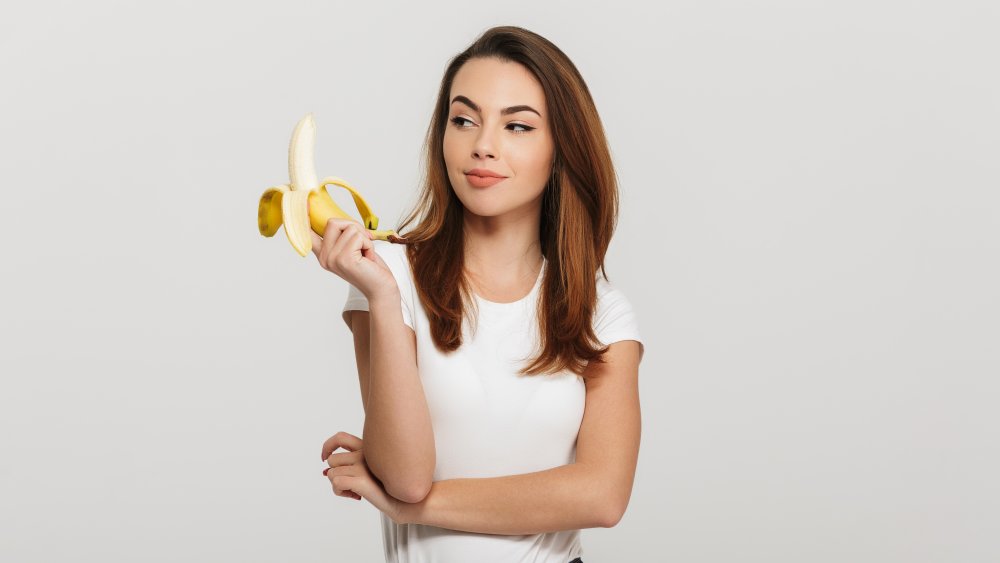 Woman holding banana