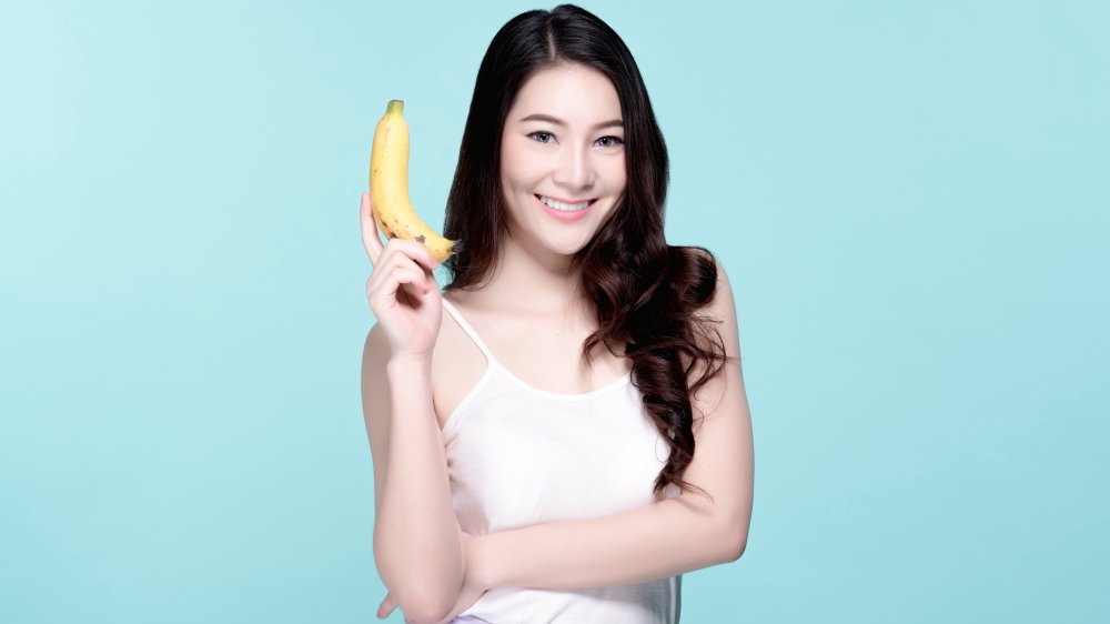 Woman holding banana