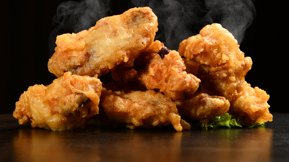 Fried chicken on a black surface