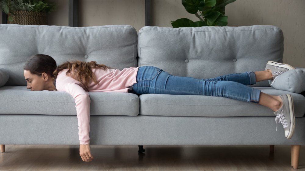 woman sleeping on couch