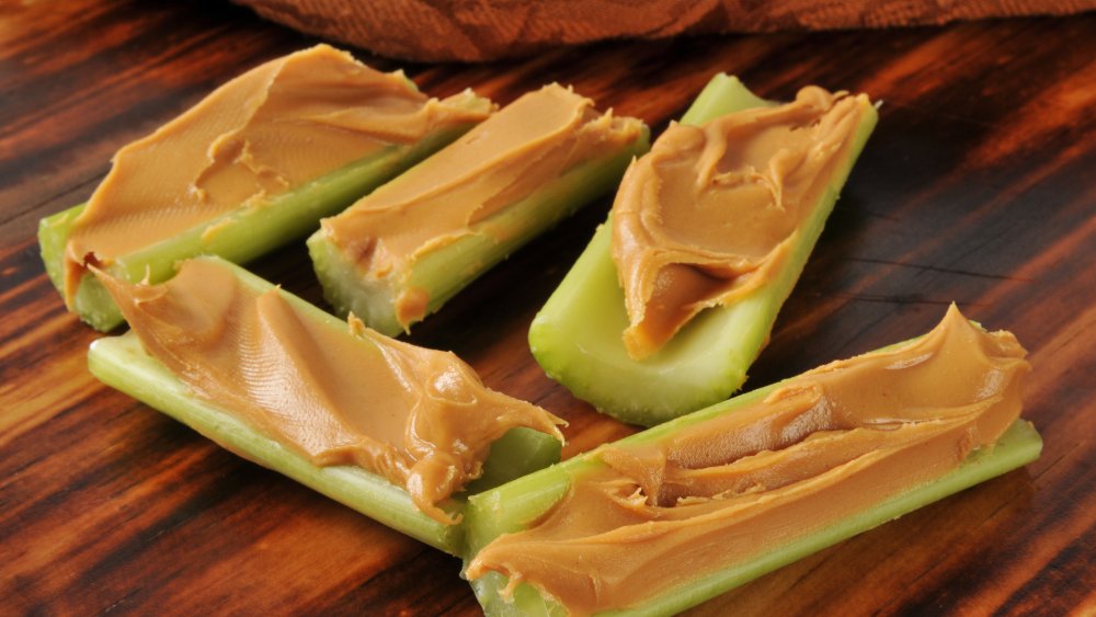 Celery sticks filled with peanut butter on a table