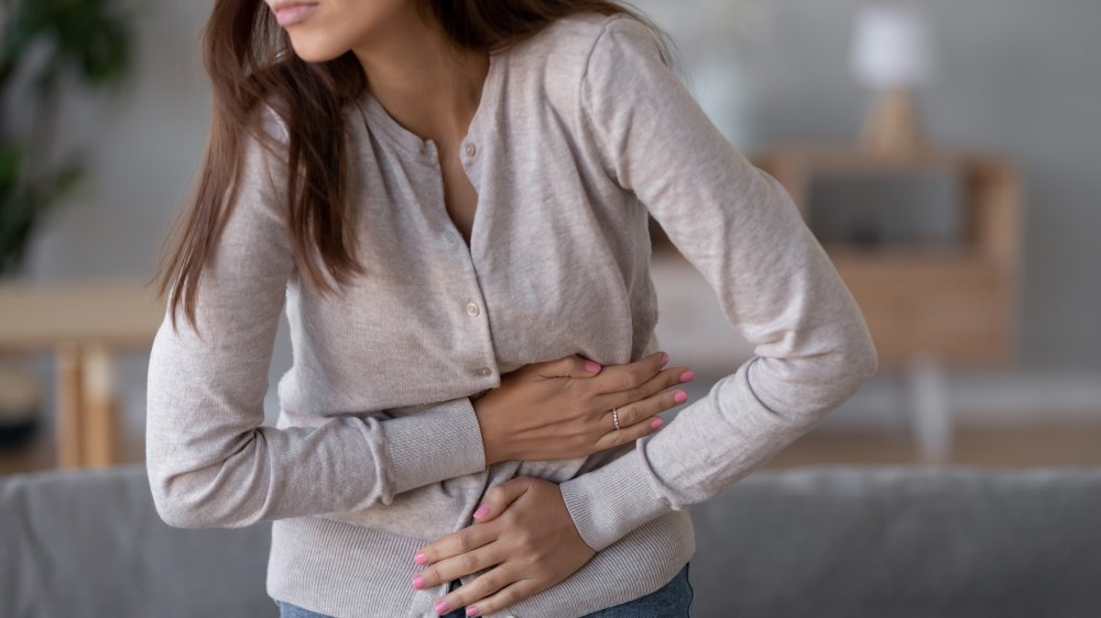 woman holding stomach