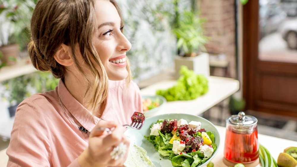 woman eating salad