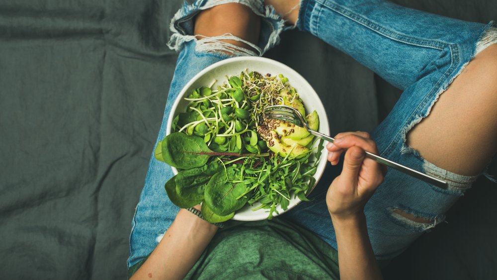 woman eating salad