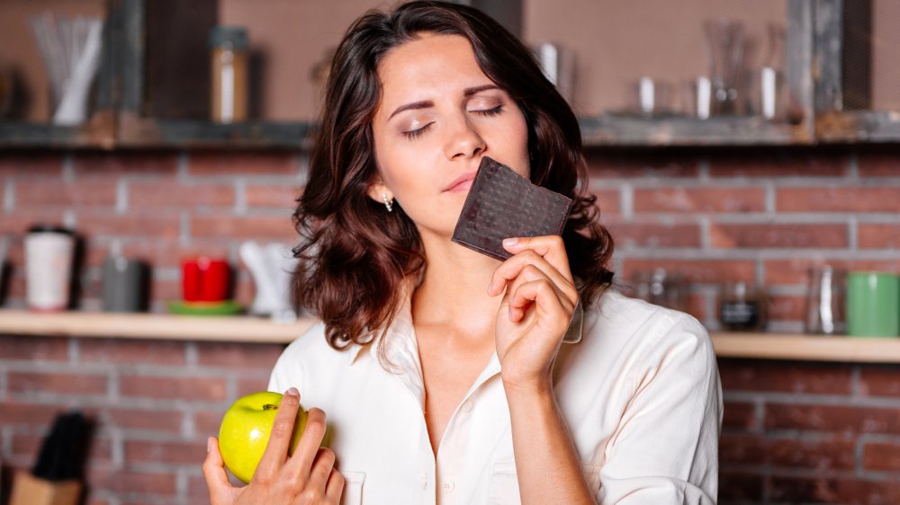 a woman experiencing period cravings