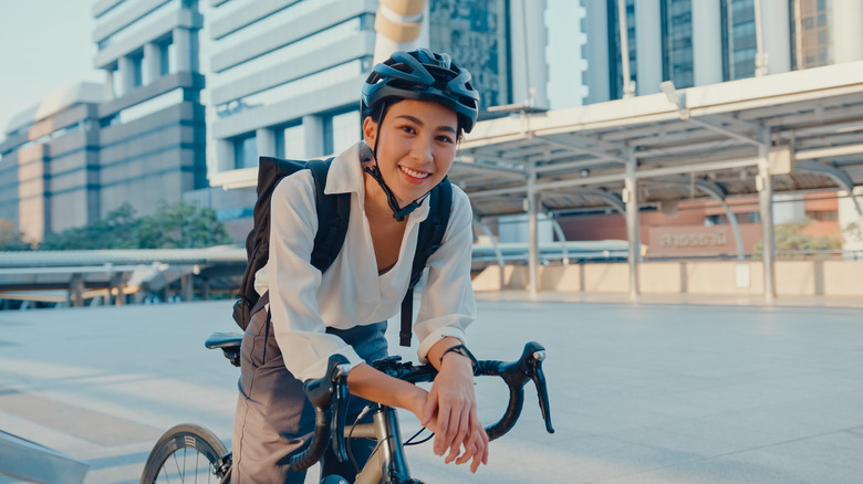 smiling woman wearing bike helmet