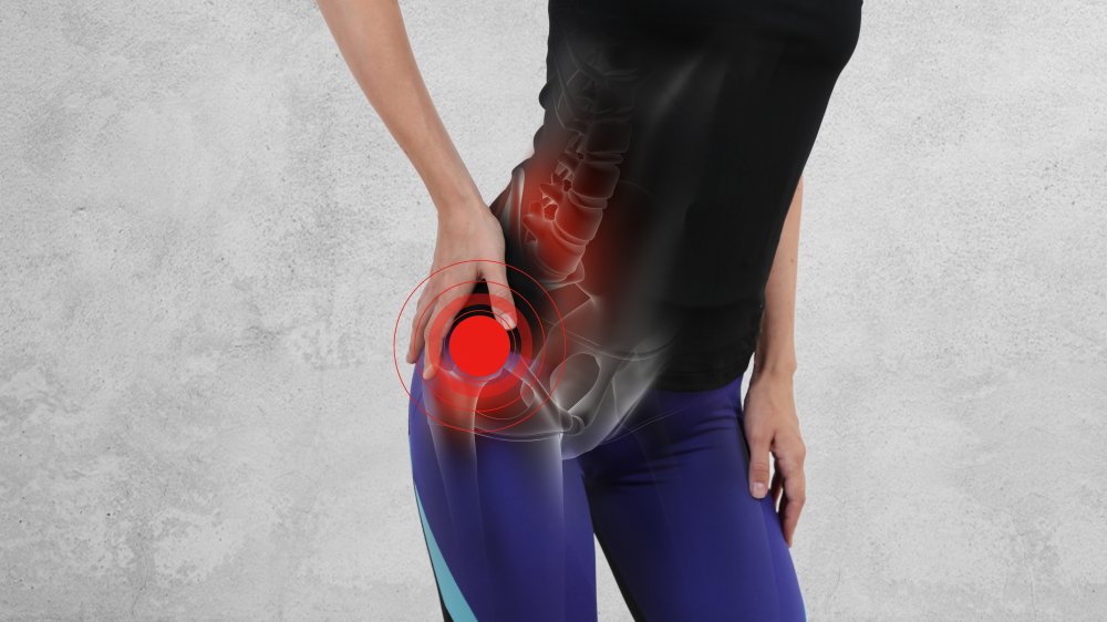 A woman suffering with hip pain, concept