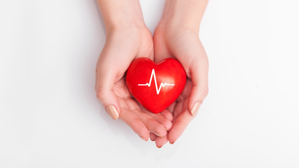 A woman's hands holding a heart