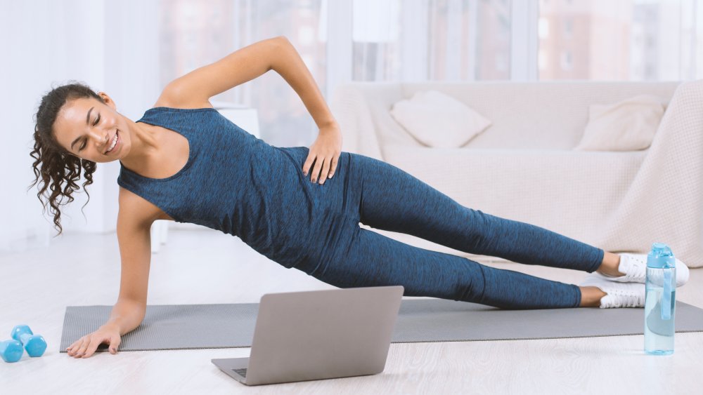 A woman doing a side plank