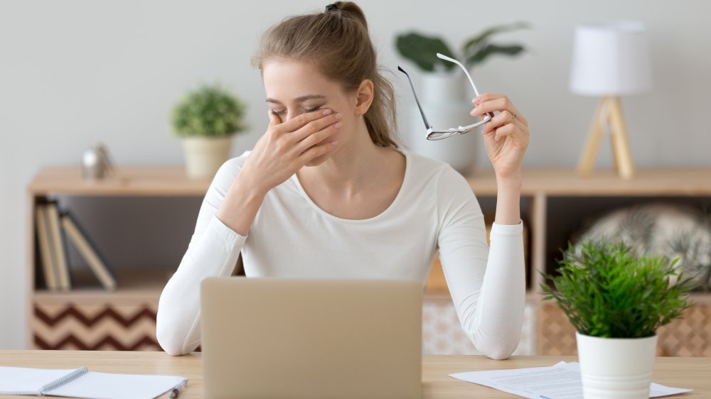 woman tired at desk