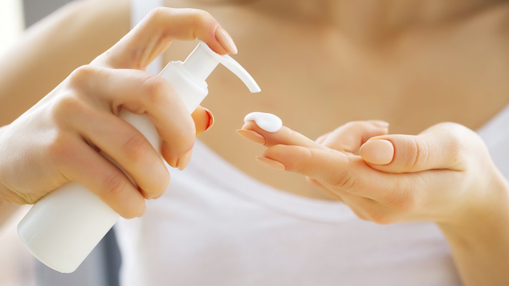 Woman holding lotion