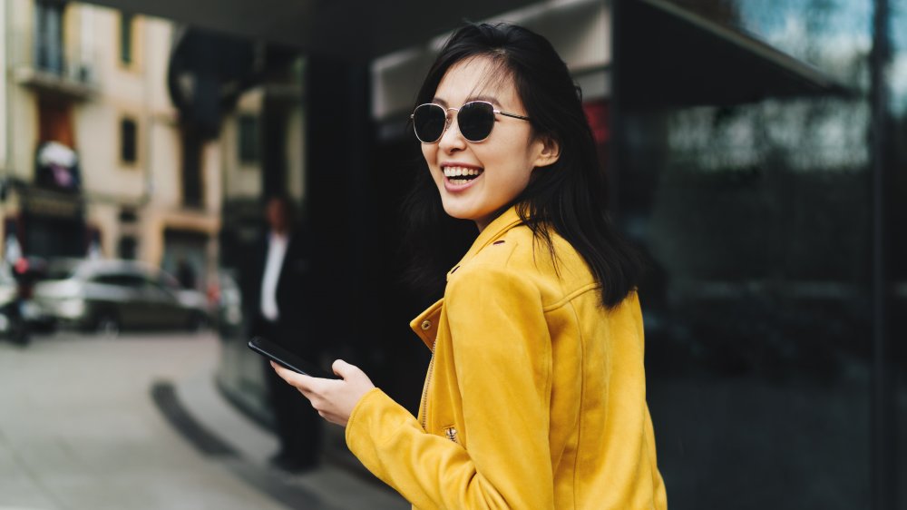 A woman walking and smiling