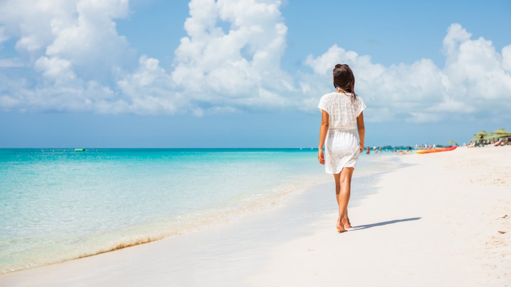 A woman walking on the beach