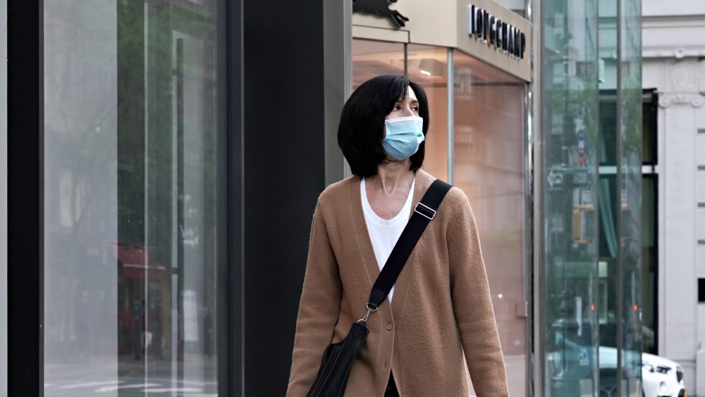 Woman wearing a mask while walking