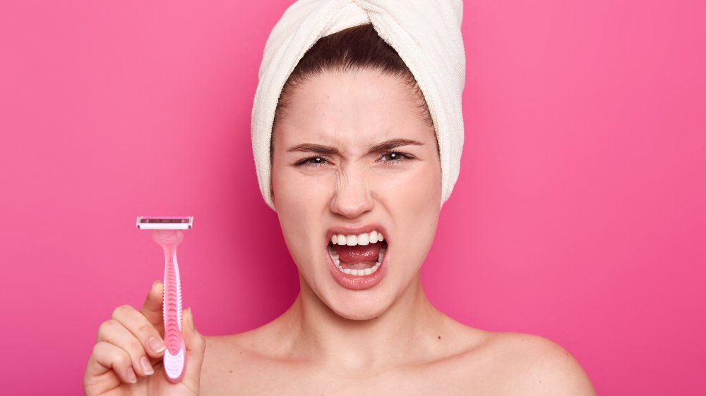 woman shaving legs