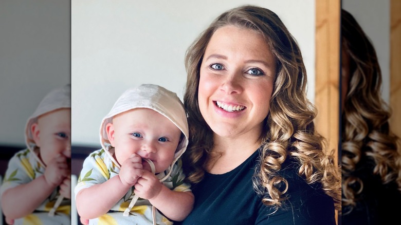 Anna Duggar holding baby smiling