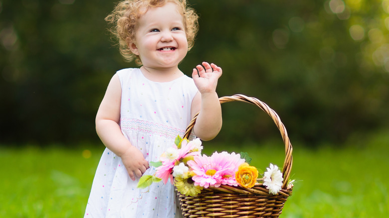 child with flower basket