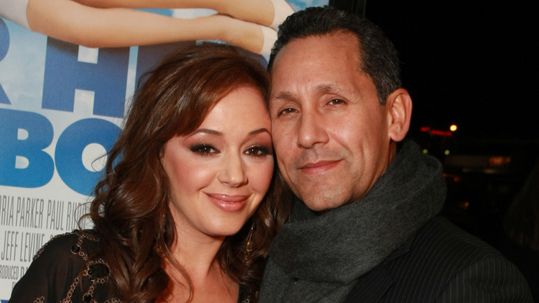 Leah Remini smiling alongside Angelo Pagan