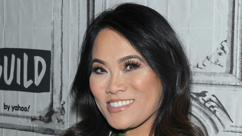 Dr. Pimple Popper, AKA Sandra Lee, smiles on the red carpet