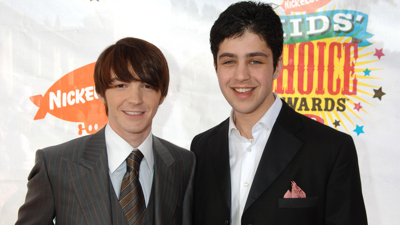 Young Drake Bell and Josh Peck posing for photos