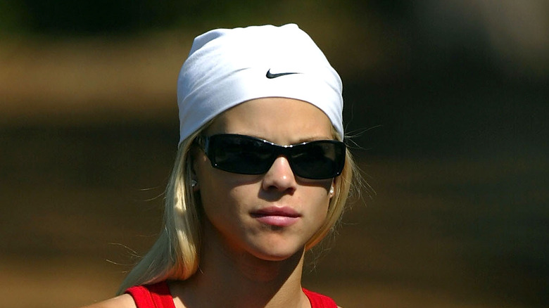 Elin Nordegren smiling with sunglasses on