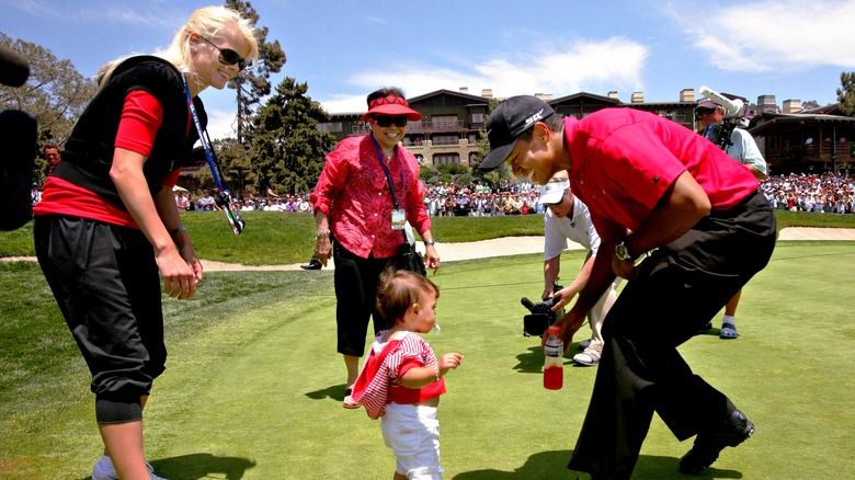 Tiger Woods and Elin Nordegren with their daughter Sam