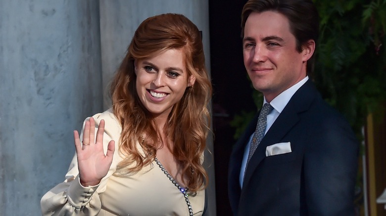 Princess Beatrice waving next to Edoardo Mozzi