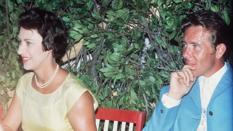 Princess Margaret and Lord Snowdon in front of bush