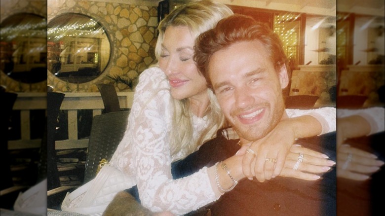 Kate Cassidy hugging Liam Payne while he smiles