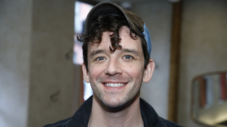 Michael Urie wearing a hat