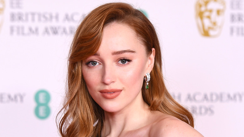 Phoebe Dynevor wearing emerald earrings