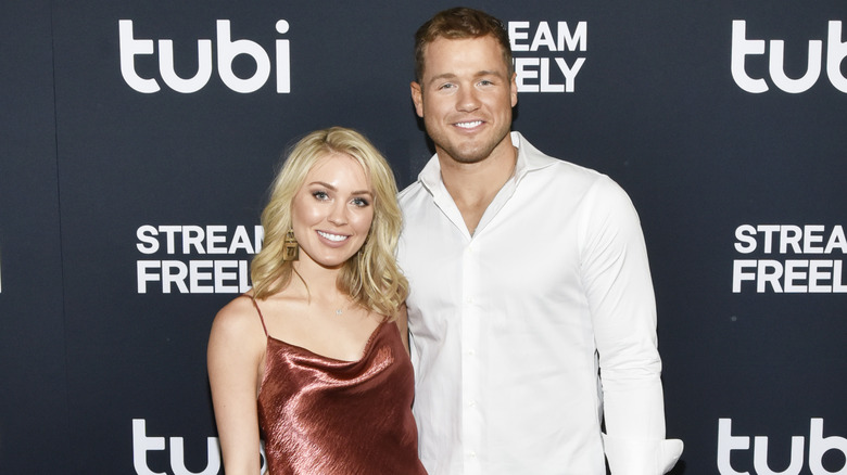 Cassie Randolph and Colton Underwood pose together on the red carpet