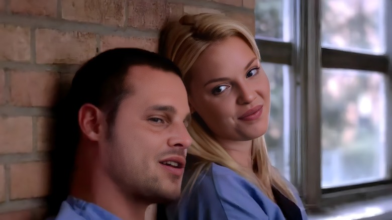 Alex and Izzie happy in scrubs