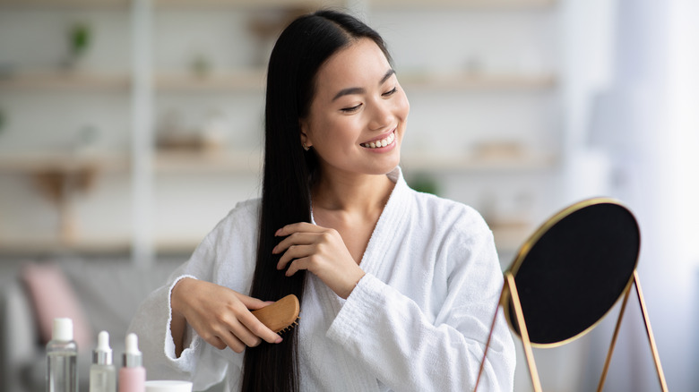 Woman brushing fine hair