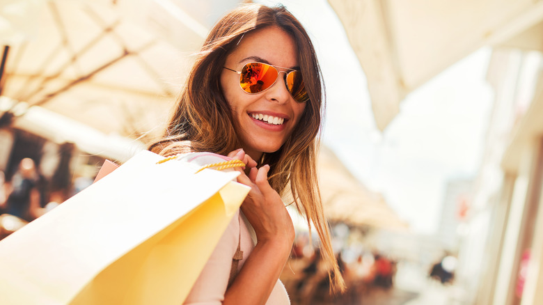 Smiling woman with bag