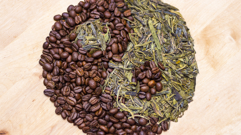 Coffee beans and tea leaves in a yin yang formation