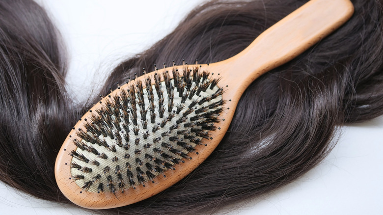 Boar bristle paddle brush with sleek hair 