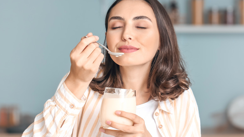 Woman eating yogurt