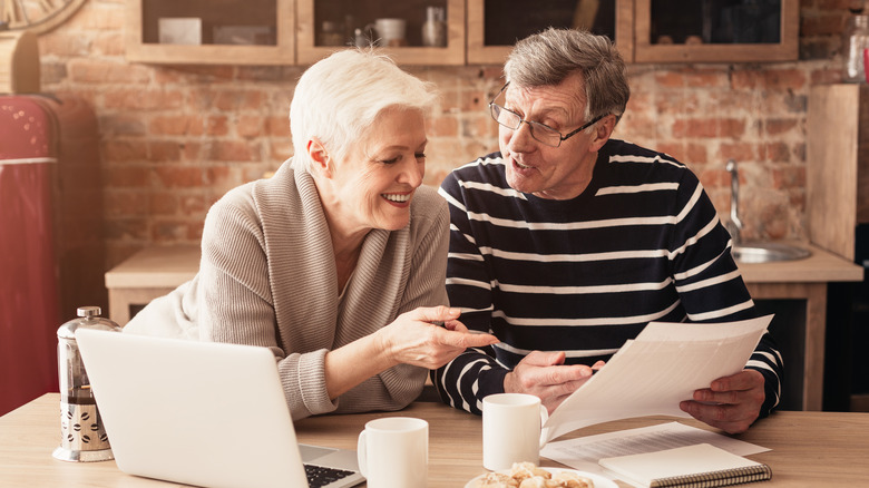 Couple discussing finances over breakfast