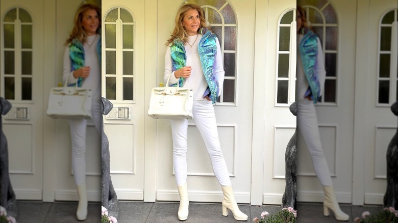 Woman in white denim and blue vest