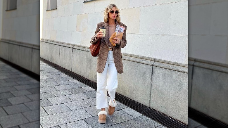 Woman in plaid blazer, white denim