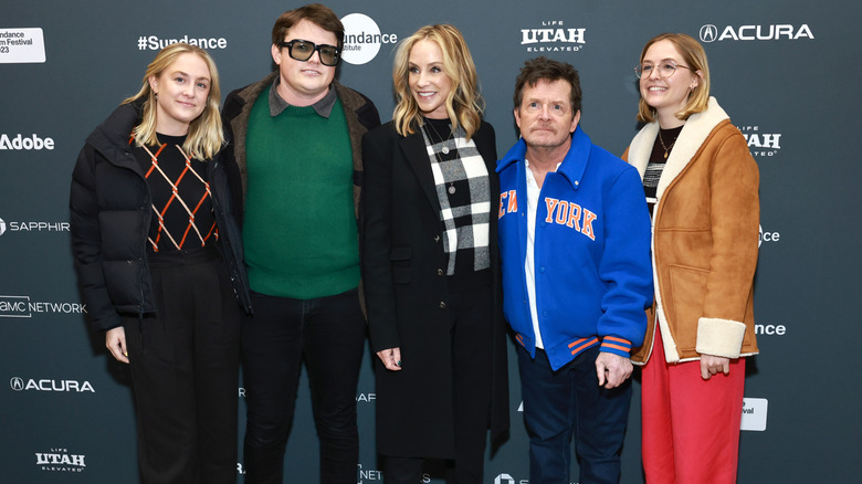 Michael J. Fox standing with his wife and three of their children