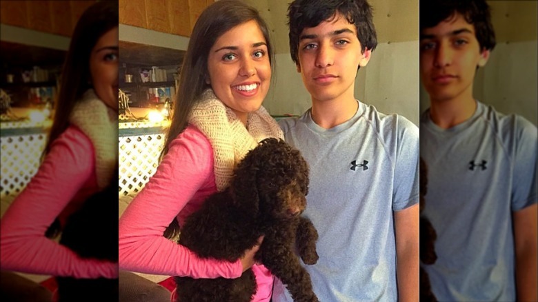 Rena and Nalin Haley posing with dog