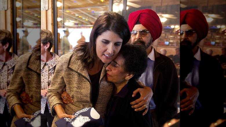 Nikki Haley hugging her mom while her dad stands in the background