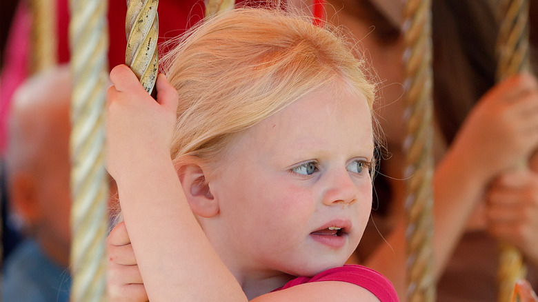 Lena Tindall on a carousel