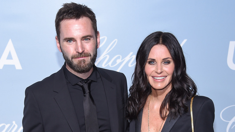 Johnny McDaid and Courteney Cox at event