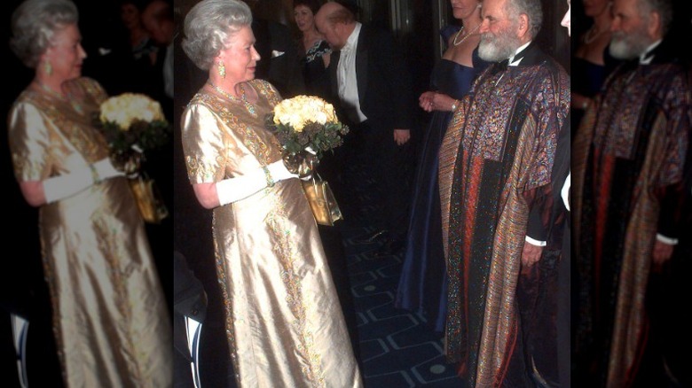 Queen Elizabeth II wearing long gold dress