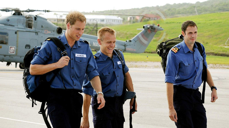 Prince William and two Royal Navy doctors walking