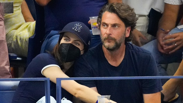 Alexandra Daddario leaning into Andrew Form at U.S. Open